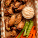 Crispy air fryer chicken wings served with ranch dip and vegetables