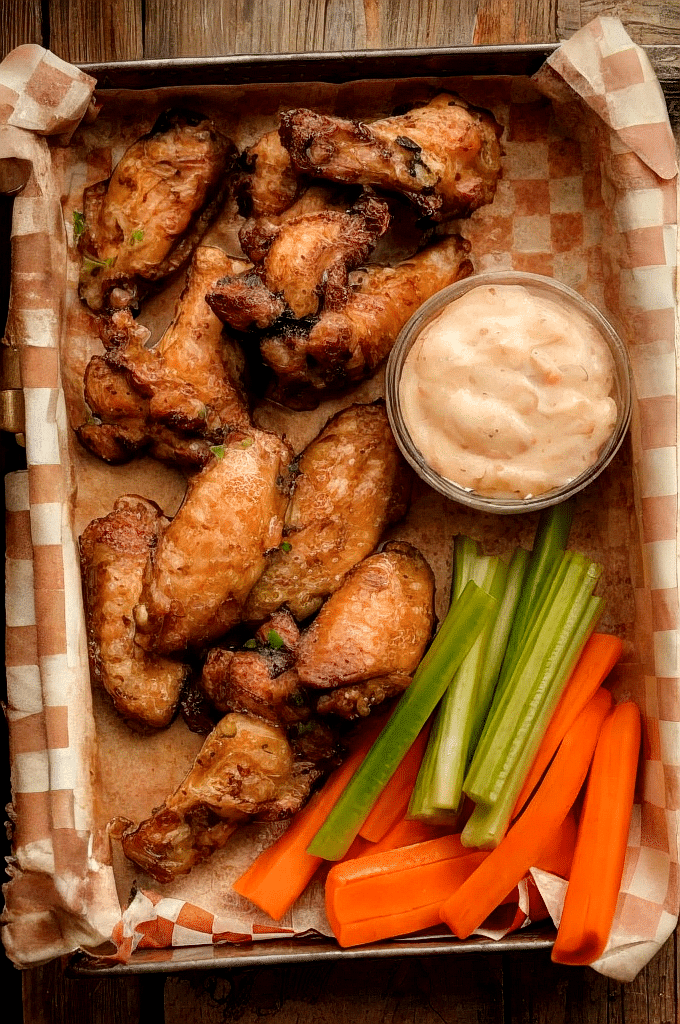 Crispy air fryer chicken wings served with ranch dip and vegetables