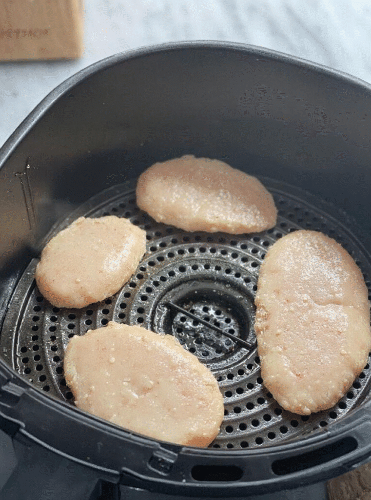 air fry chicken cutlets cooking inside the air fryer basket
